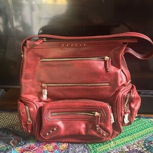 Been getting leather burgundy and gold bag